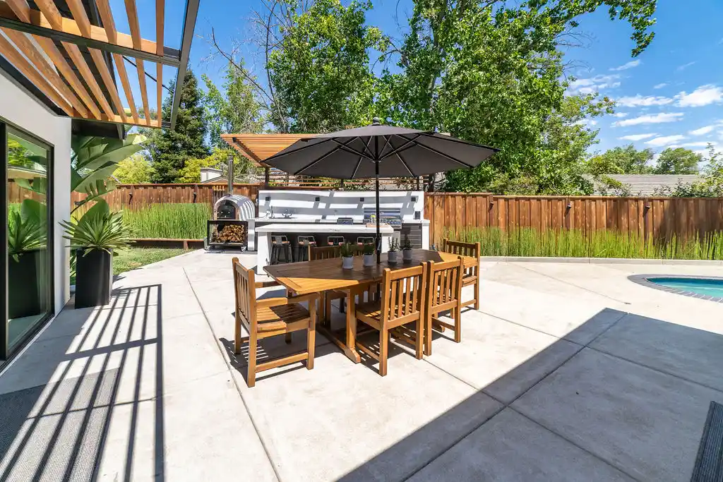 Custom outdoor living space with high-end finishes at twilight